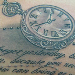 Tattoo of pocket watch with text