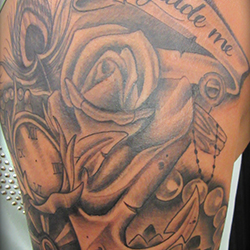 Tattoo of anchor roses watch and ship wheel
