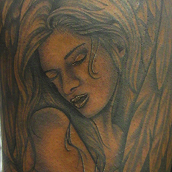Tattoo of woman angel