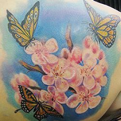 Tattoo of flowers and butterflys